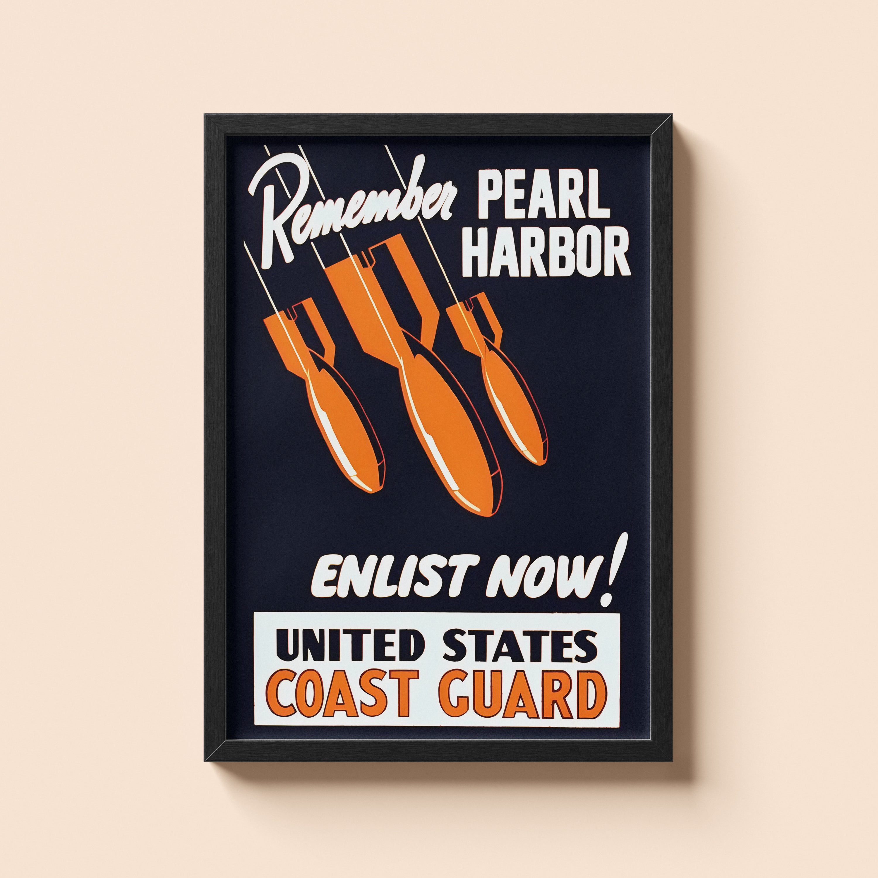 Framed poster with 'Remember Pearl Harbor, Enlist Now! United States Coast Guard' text and bomb graphics on a beige wall.